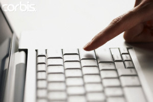 Finger typing on laptop